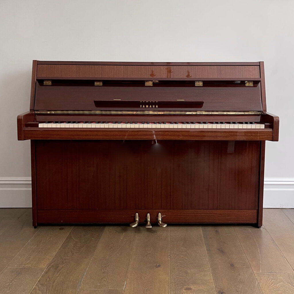 A Yamaha Upright Piano, Mahogany Gloss