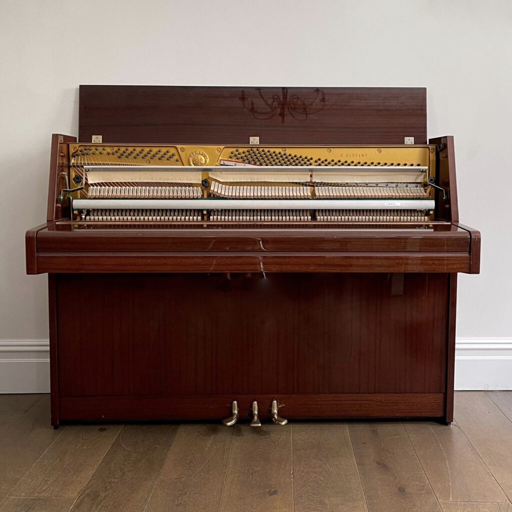A Yamaha Upright Piano, Mahogany Gloss
